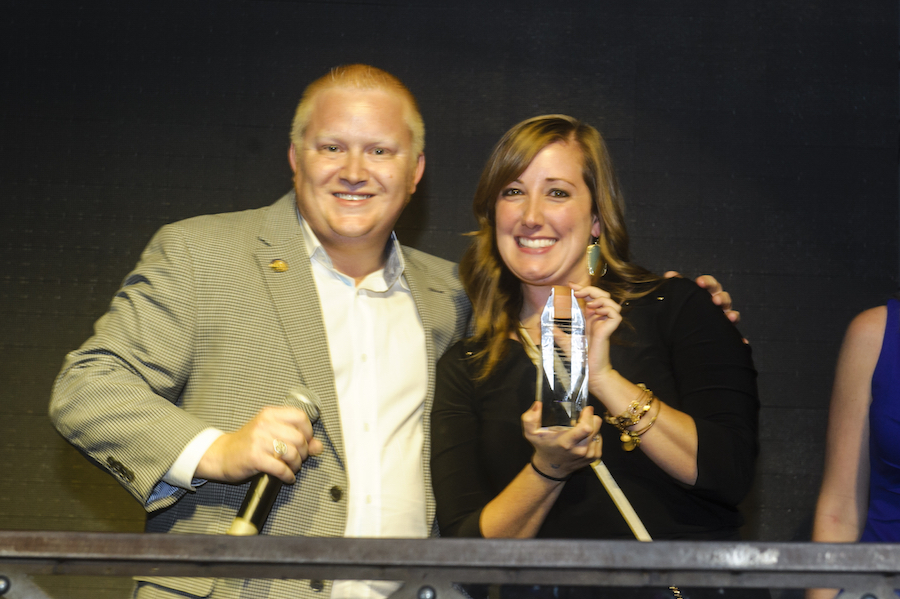 Shyla Magee (right) accepting the Large NOTY on behalf of the Greater Las Vegas Association of REALTORS® YPN.