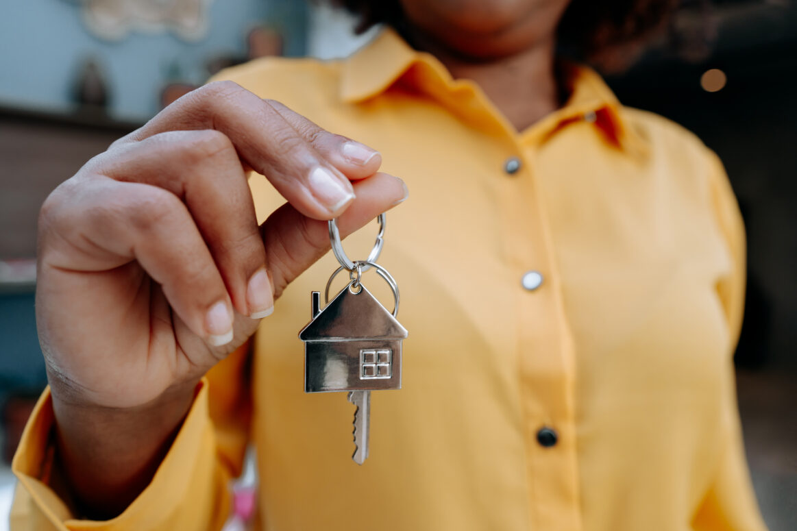 Real Estate Agent holding house key