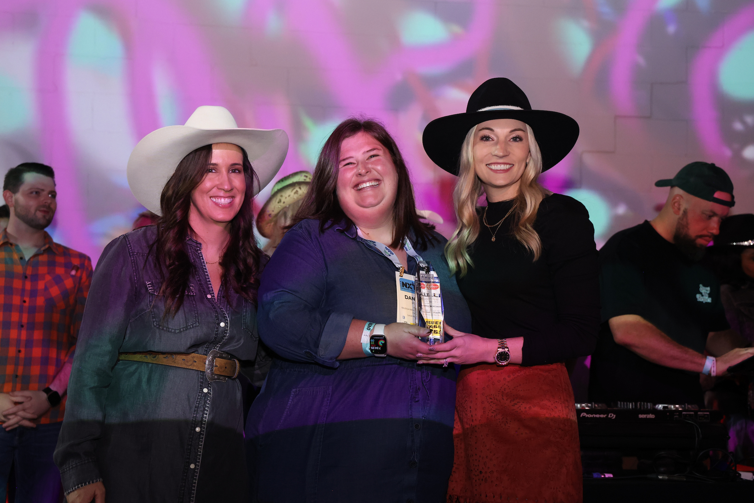 medium group of ypn members holding an award