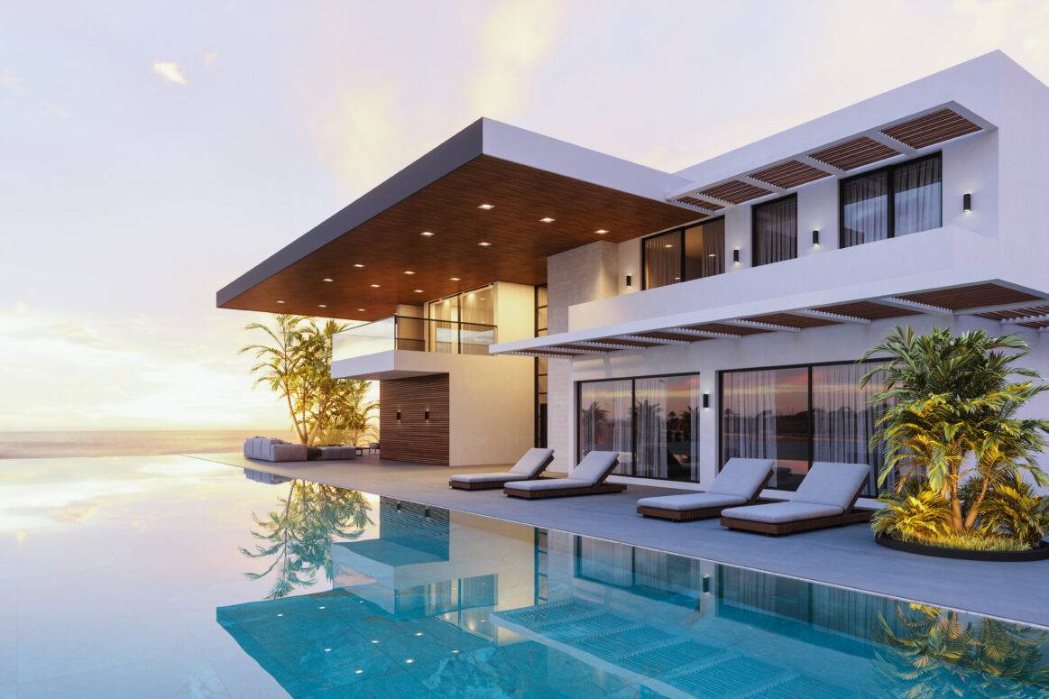 Luxury modern house with swimming pool and beautiful sea view at dusk.